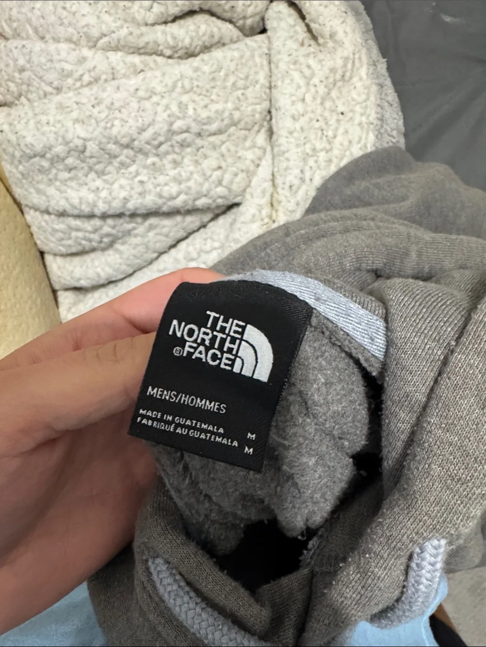 The North Face hoodie patch text